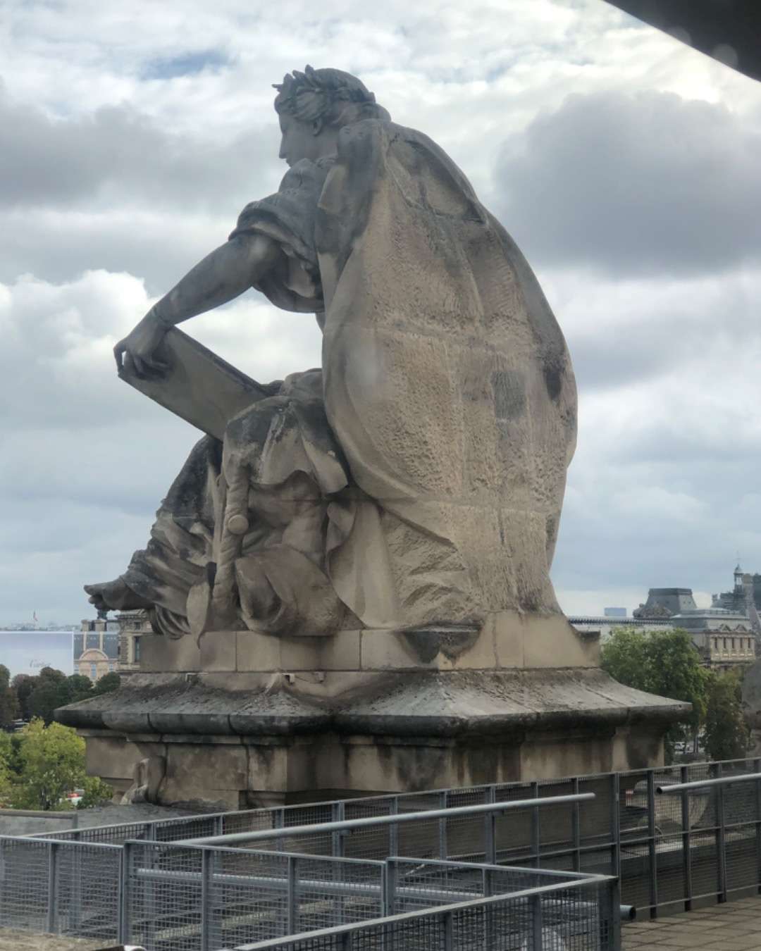 Statue of man looking to sea
